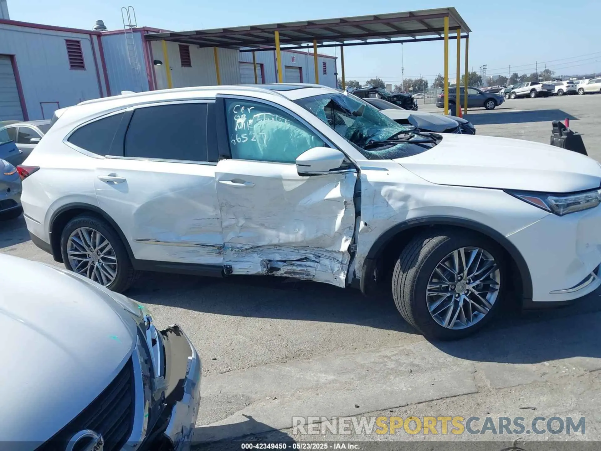 12 Photograph of a damaged car 5J8YE1H81NL039949 ACURA MDX 2022