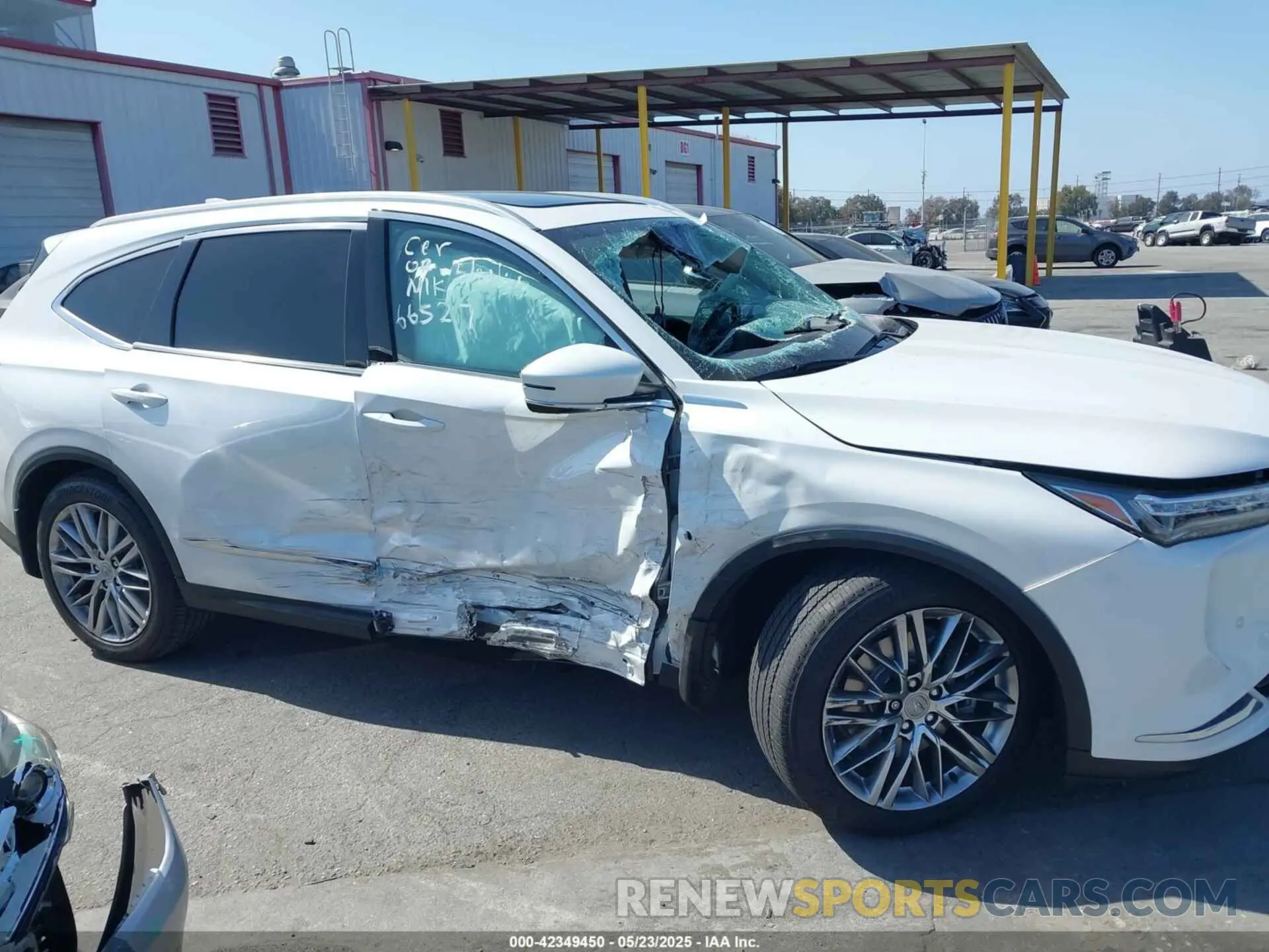 6 Photograph of a damaged car 5J8YE1H81NL039949 ACURA MDX 2022