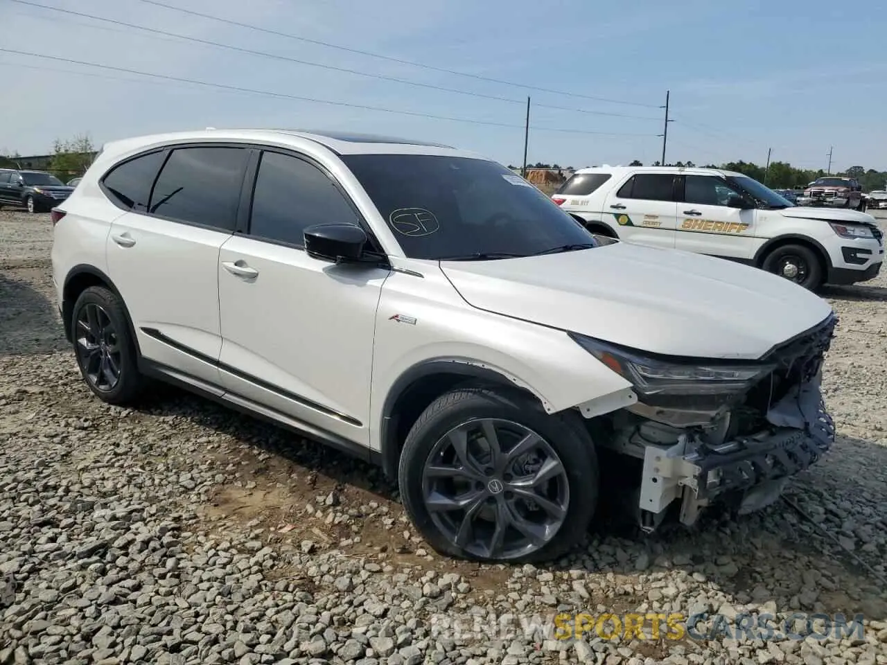 4 Photograph of a damaged car 5J8YE1H09PL011250 ACURA MDX 2023