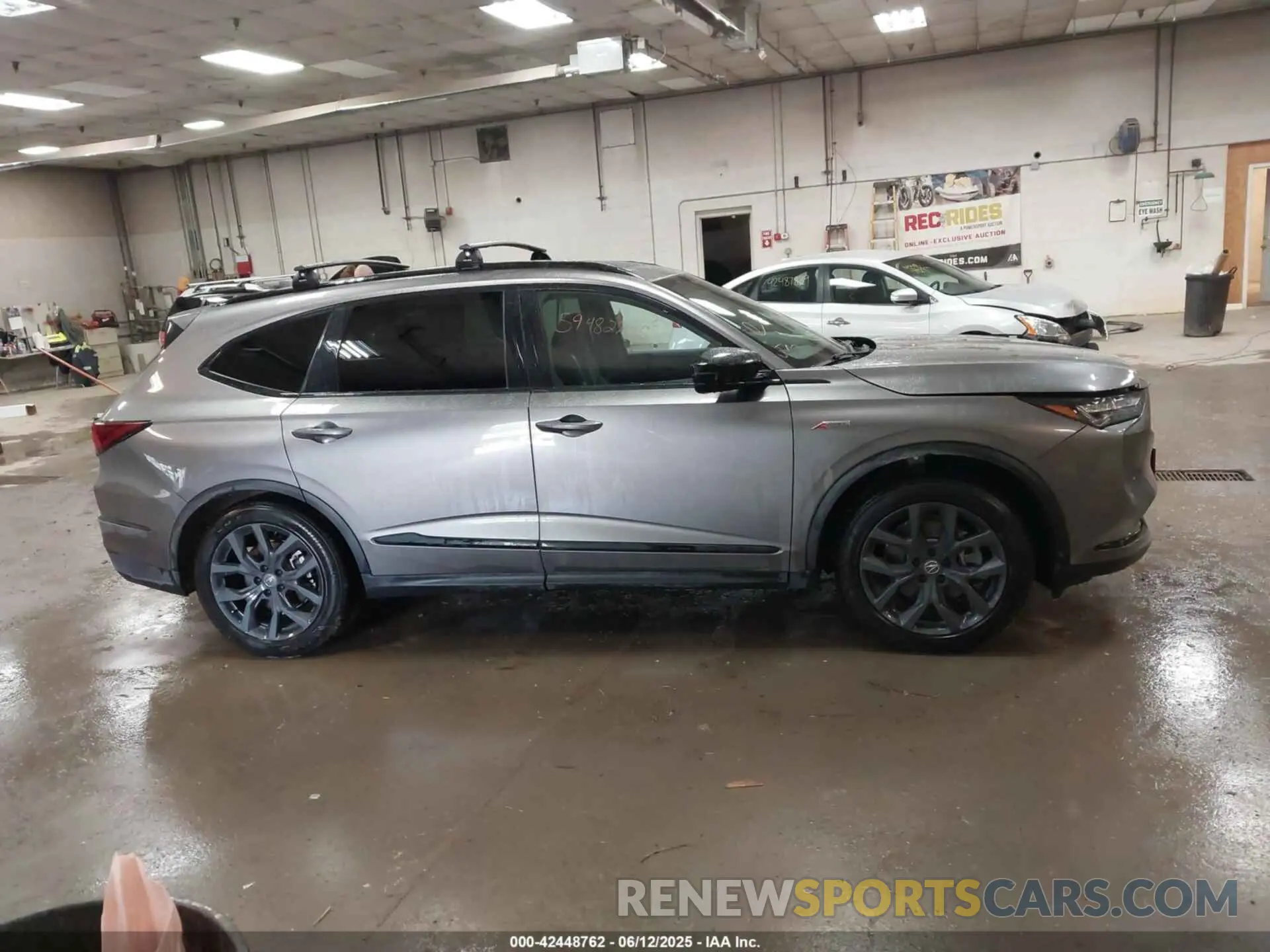 13 Photograph of a damaged car 5J8YE1H0XPL043110 ACURA MDX 2023