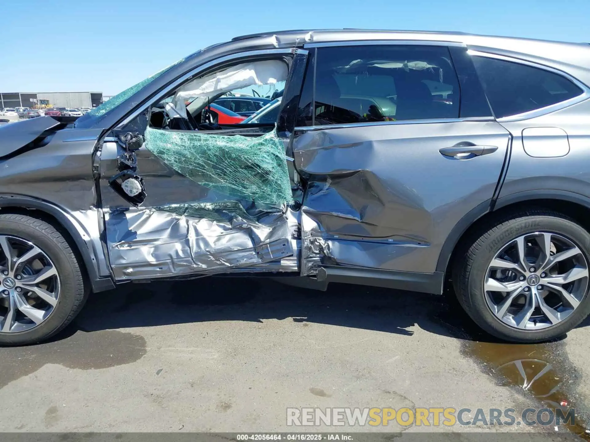 14 Photograph of a damaged car 5J8YE1H48RL007423 ACURA MDX 2024
