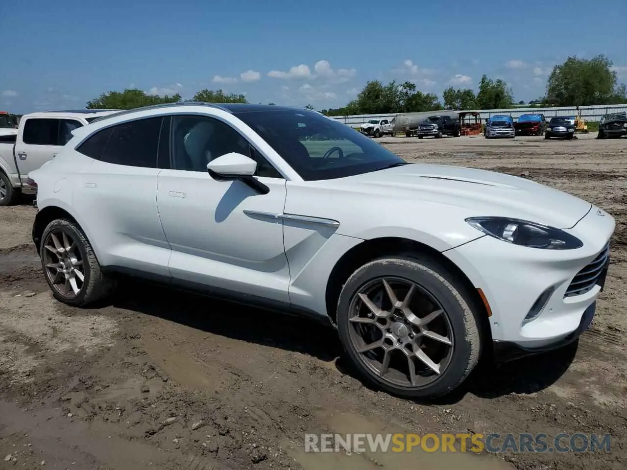 4 Photograph of a damaged car SCFVUJAW8MTV02781 ASTON MARTIN DBX 2021