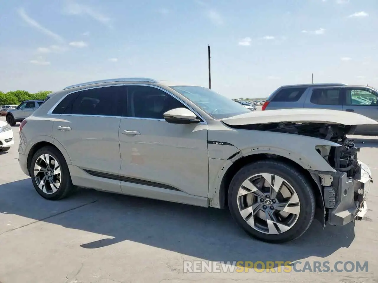 4 Photograph of a damaged car WA1AAAGEXNB023977 AUDI E-TRON 2022