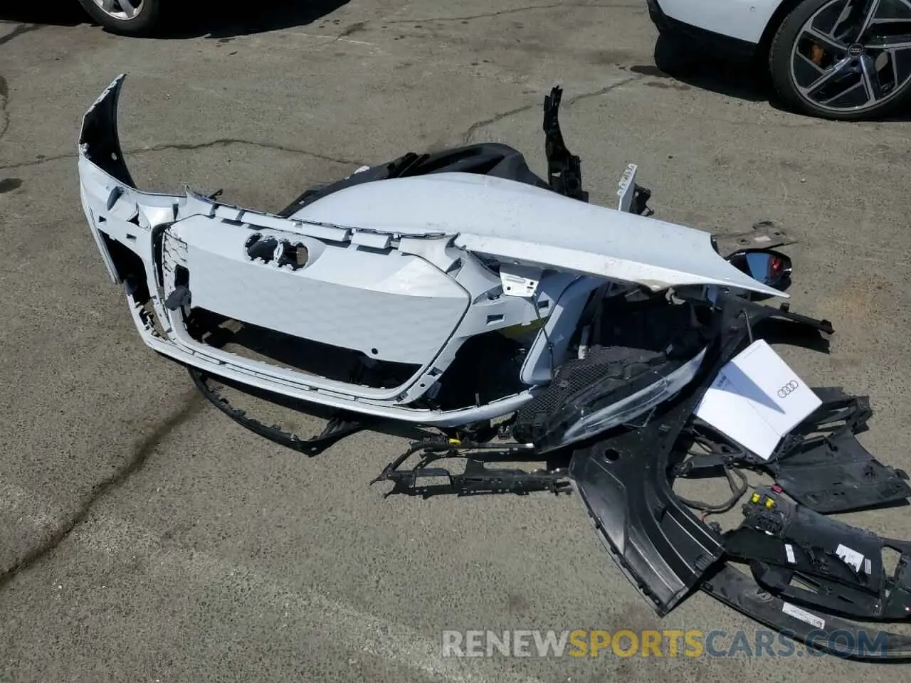 12 Photograph of a damaged car WAUBHBFW4P7902528 AUDI RS E-TRON 2023