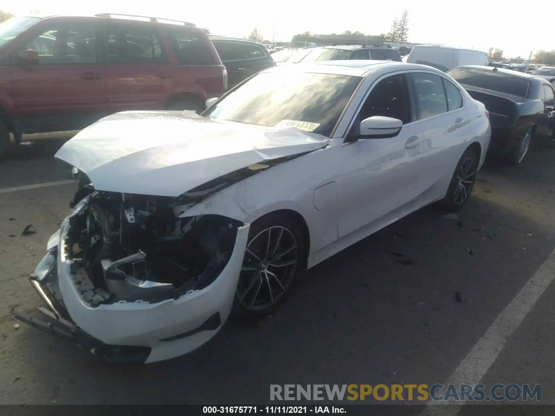 2 Photograph of a damaged car 3MW5P7J06M8C11575 BMW 3 SERIES 2021