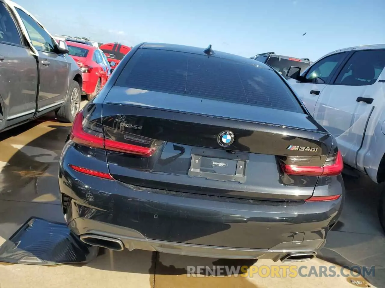 6 Photograph of a damaged car 3MW5U9J08M8B97246 BMW M3 2021