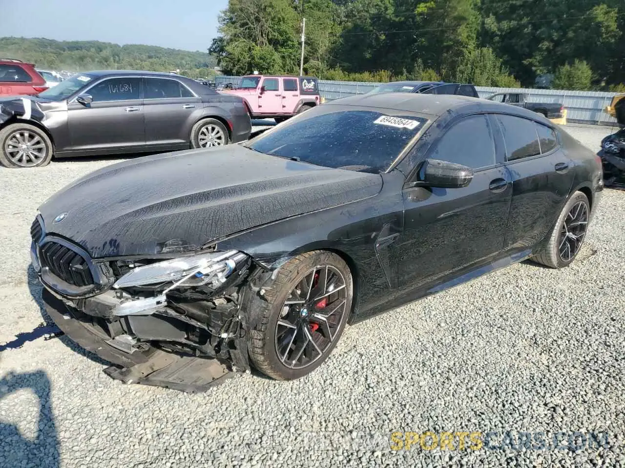 1 Photograph of a damaged car WBSGV0C01NCJ05446 BMW M8 2022