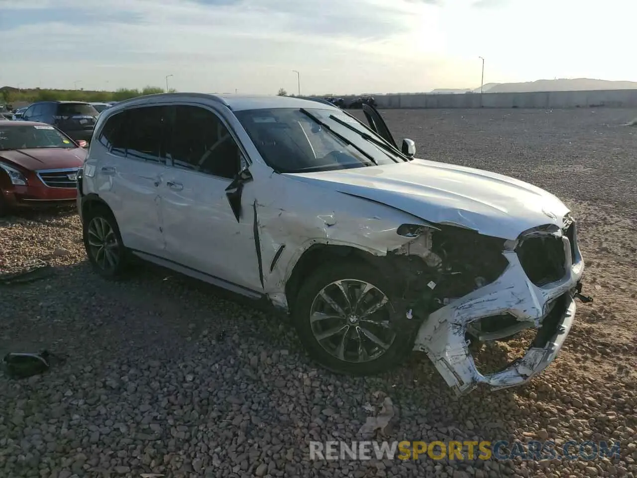 4 Photograph of a damaged car 5UXTR7C5XKLR45928 BMW X3 2019