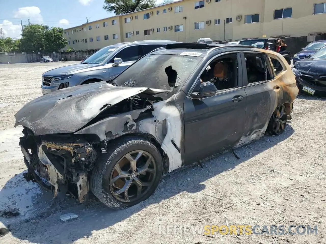 1 Photograph of a damaged car 5UX43DP05N9K34156 BMW X3 2022