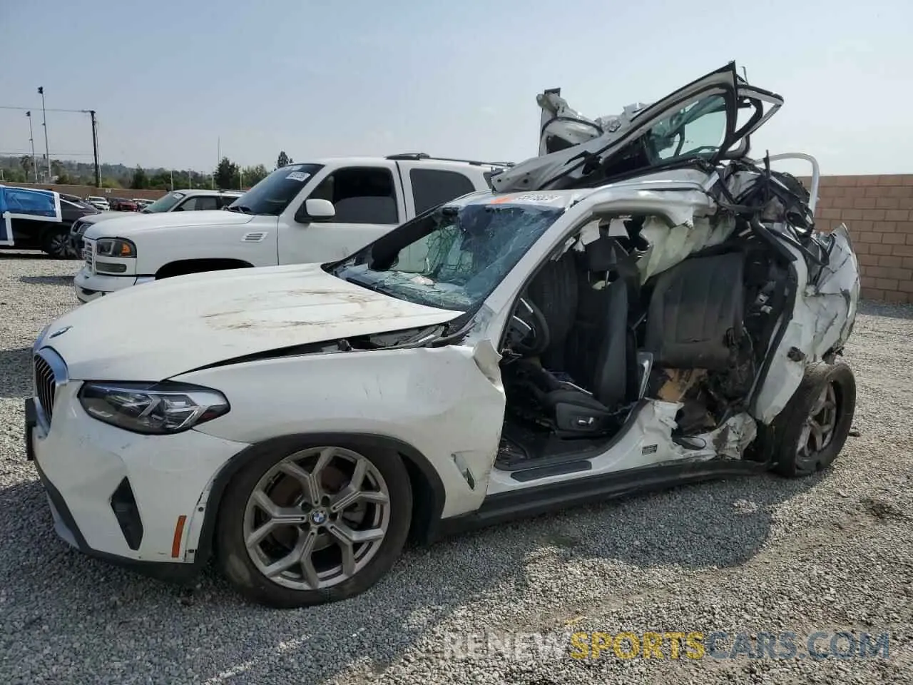 1 Photograph of a damaged car 5UX43DP08N9K66809 BMW X3 2022