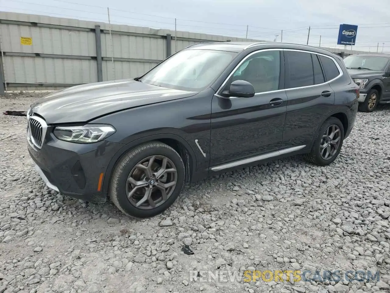 1 Photograph of a damaged car 5UX43DP01P9T33785 BMW X3 2023