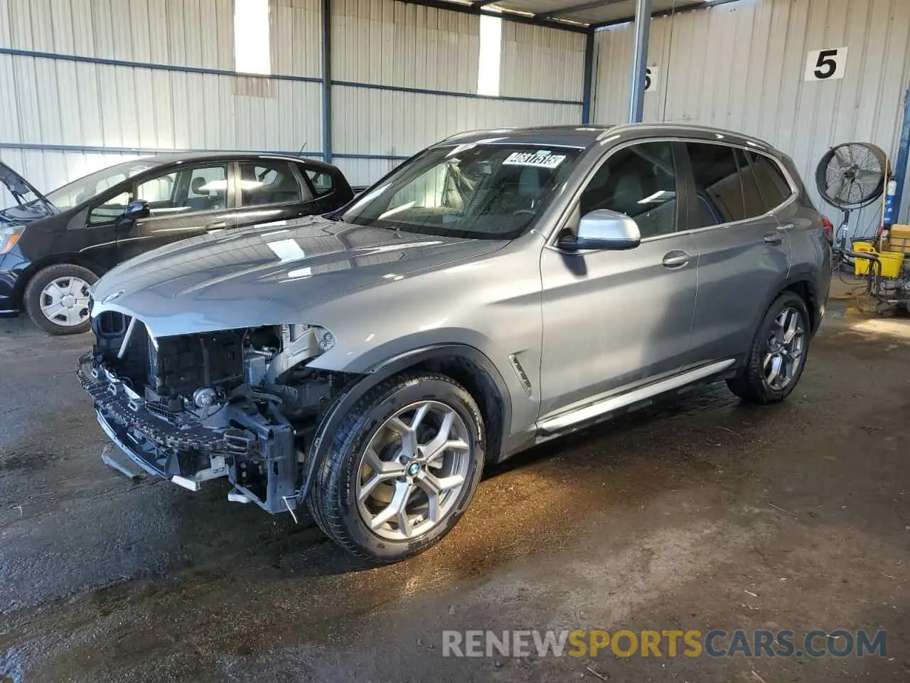1 Photograph of a damaged car 5UX43DP0XP9S11541 BMW X3 2023