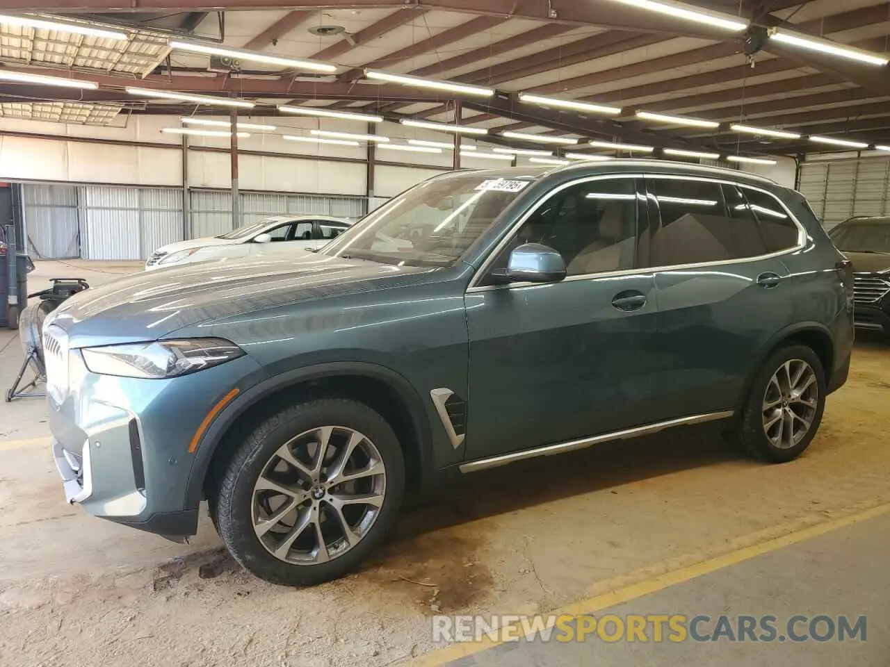1 Photograph of a damaged car 5UX23EU07R9U87468 BMW X5 2024