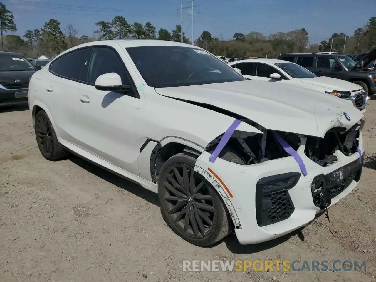 4 Photograph of a damaged car 5UXCY6C0XN9K78927 BMW X6 2022