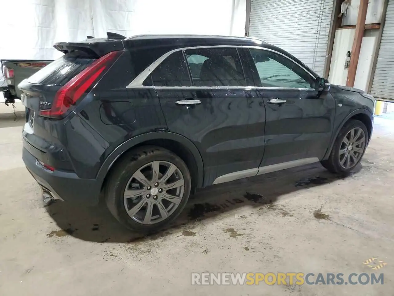 3 Photograph of a damaged car 1GYFZDR41MF001099 CADILLAC XT4 2021