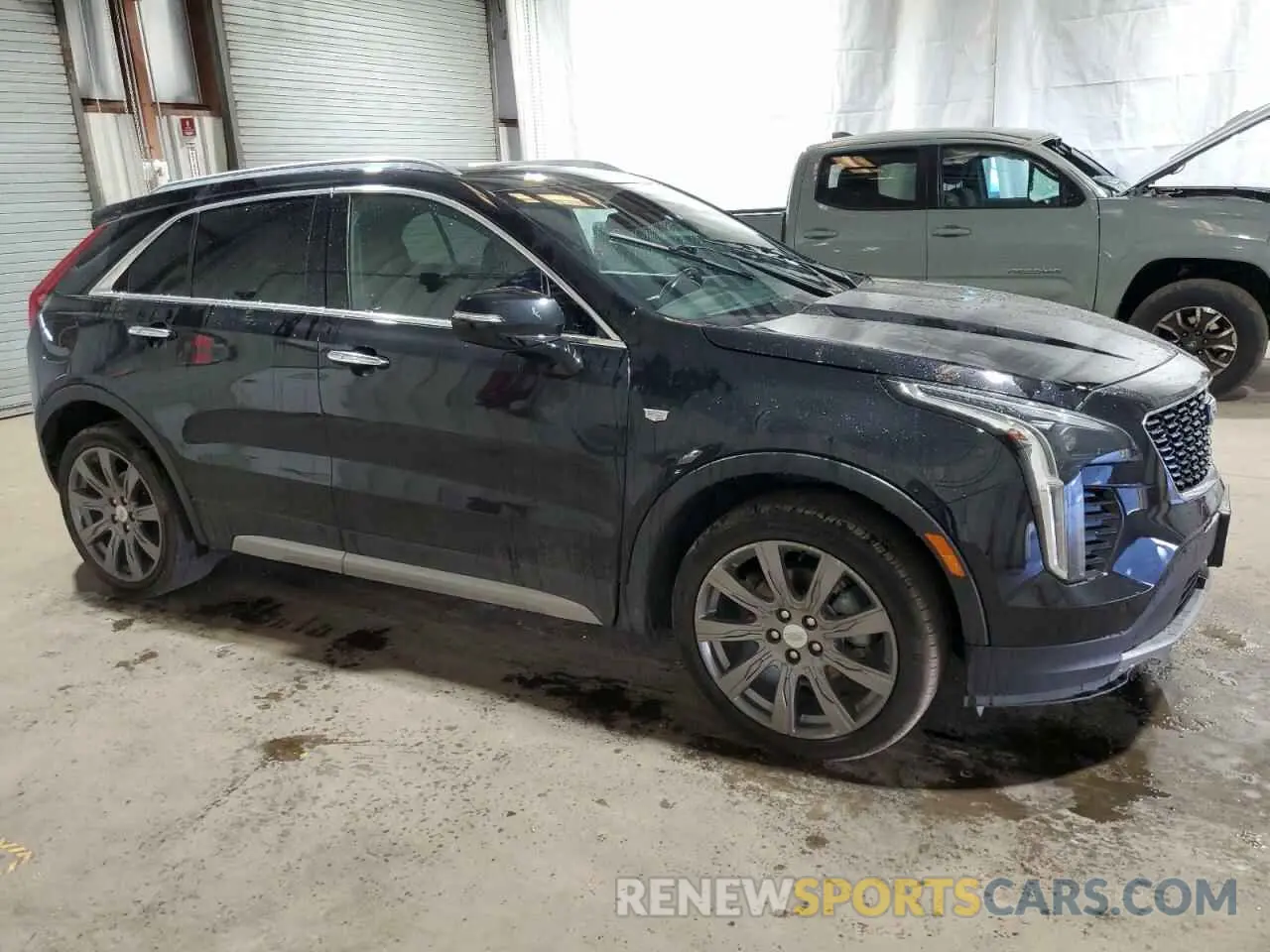 4 Photograph of a damaged car 1GYFZDR41MF001099 CADILLAC XT4 2021
