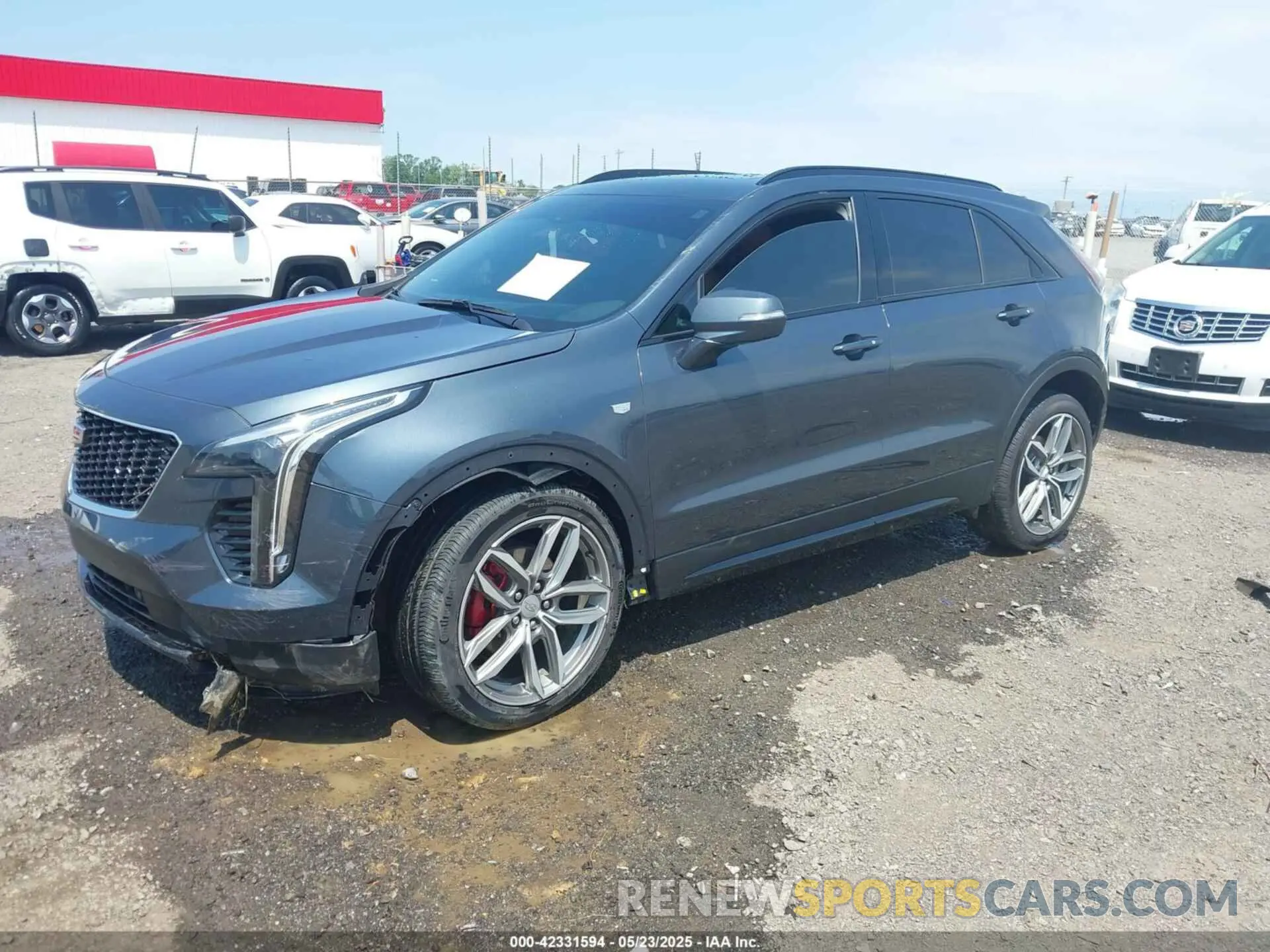2 Photograph of a damaged car 1GYFZER41MF079193 CADILLAC XT4 2021