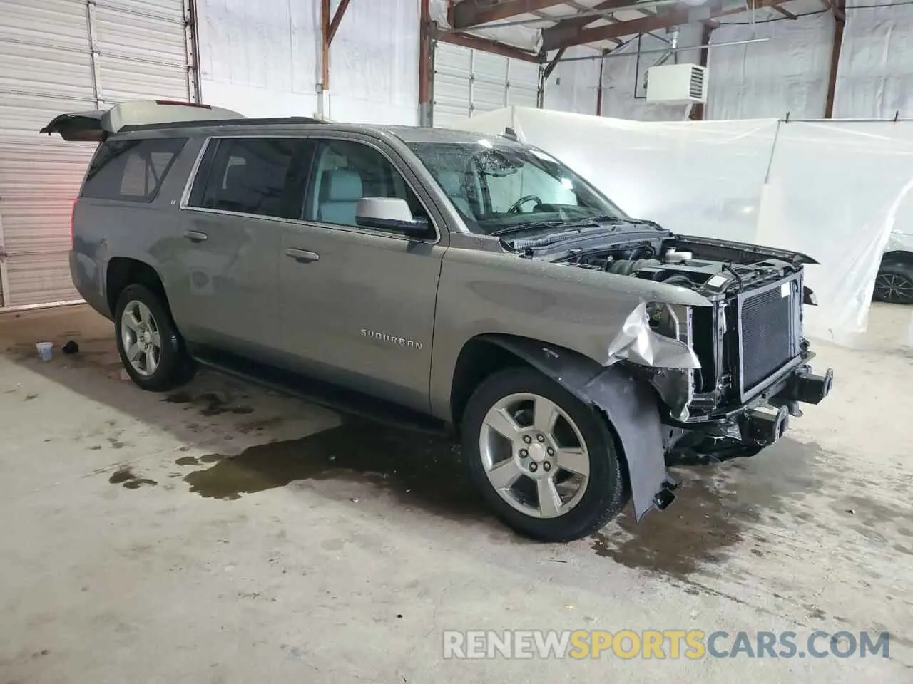 4 Photograph of a damaged car 1GNSKHKC2KR227348 CHEVROLET SUBURBAN 2019