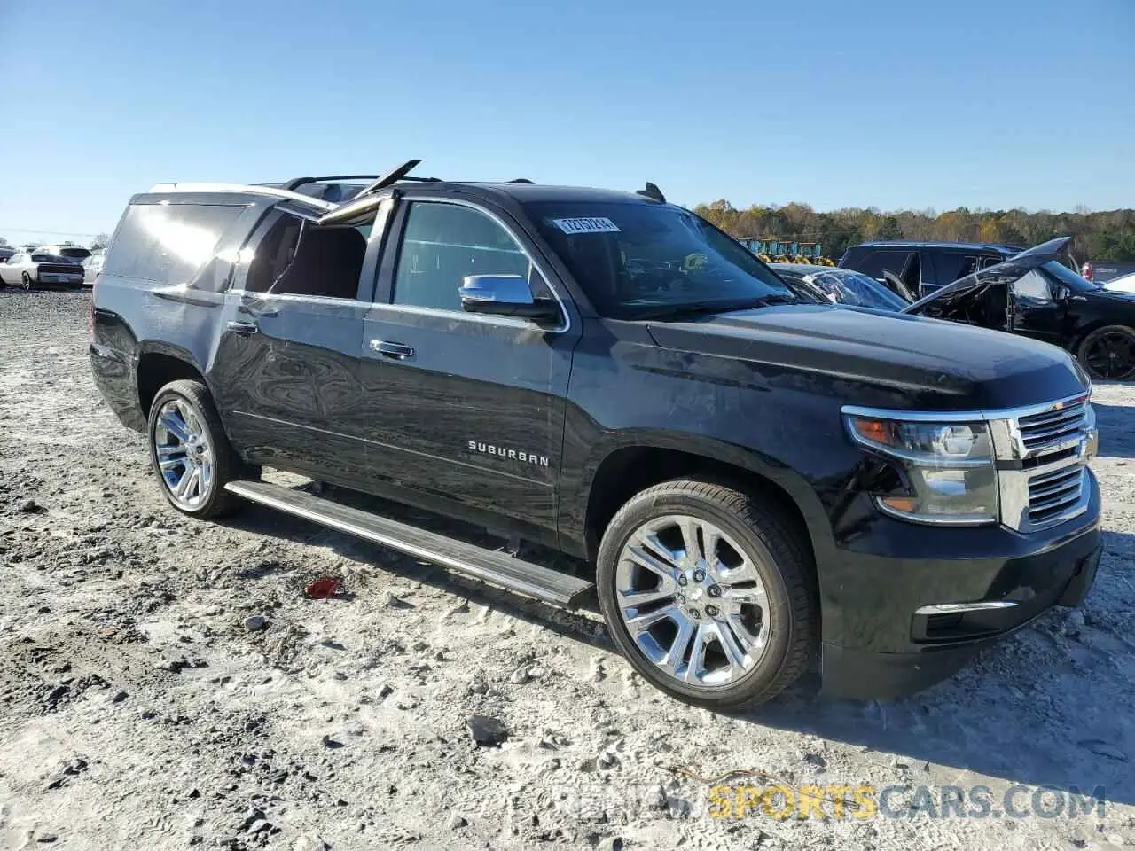 4 Photograph of a damaged car 1GNSKJKJXKR323704 CHEVROLET SUBURBAN 2019