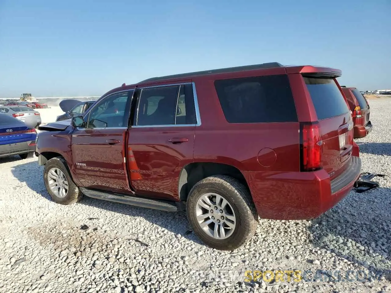 2 Photograph of a damaged car 1GNSCAEC6KR107200 CHEVROLET TAHOE 2019
