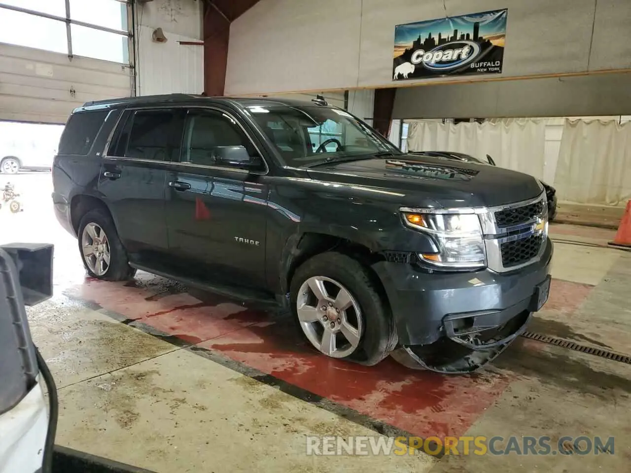 4 Photograph of a damaged car 1GNSKBKC1KR357280 CHEVROLET TAHOE 2019