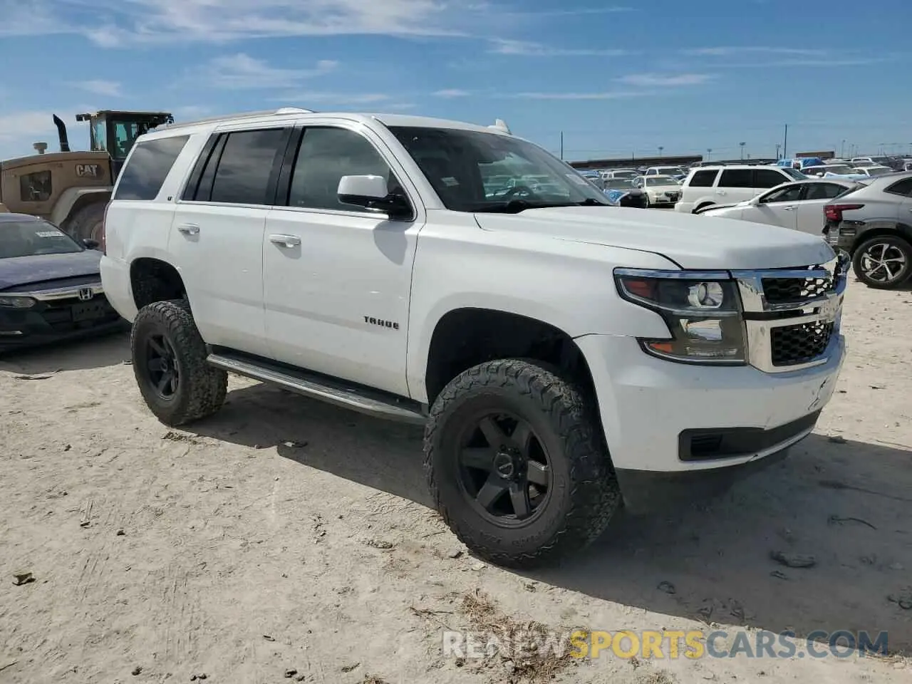 4 Photograph of a damaged car 1GNSKBKC7KR392177 CHEVROLET TAHOE 2019