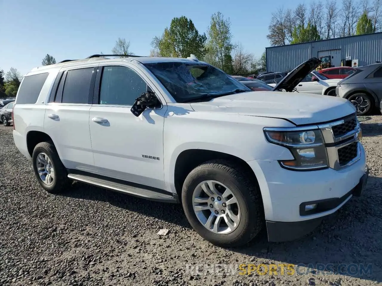 4 Photograph of a damaged car 1GNSKBKC5LR243378 CHEVROLET TAHOE 2020