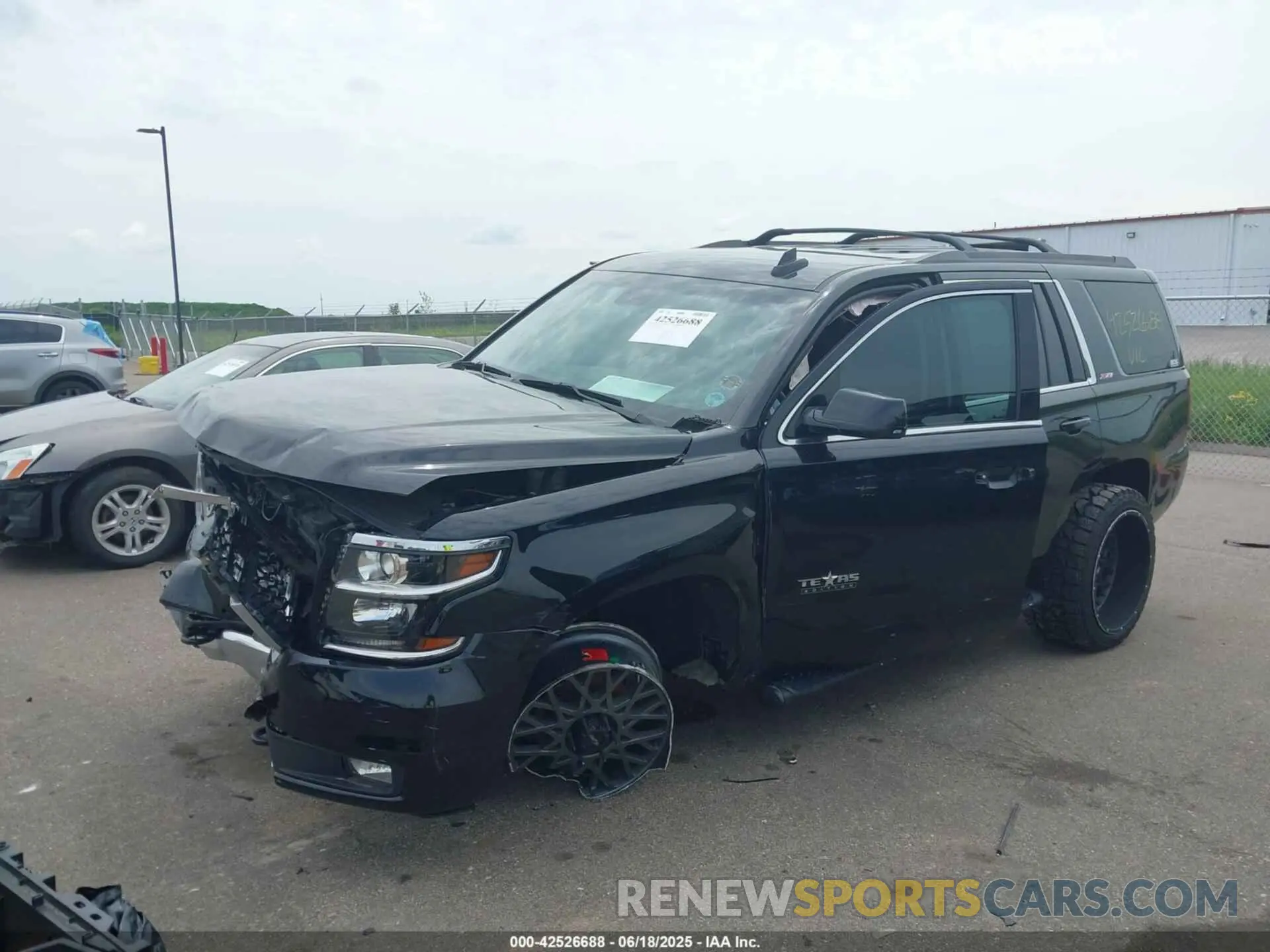 2 Photograph of a damaged car 1GNSKBKC9LR129187 CHEVROLET TAHOE 2020