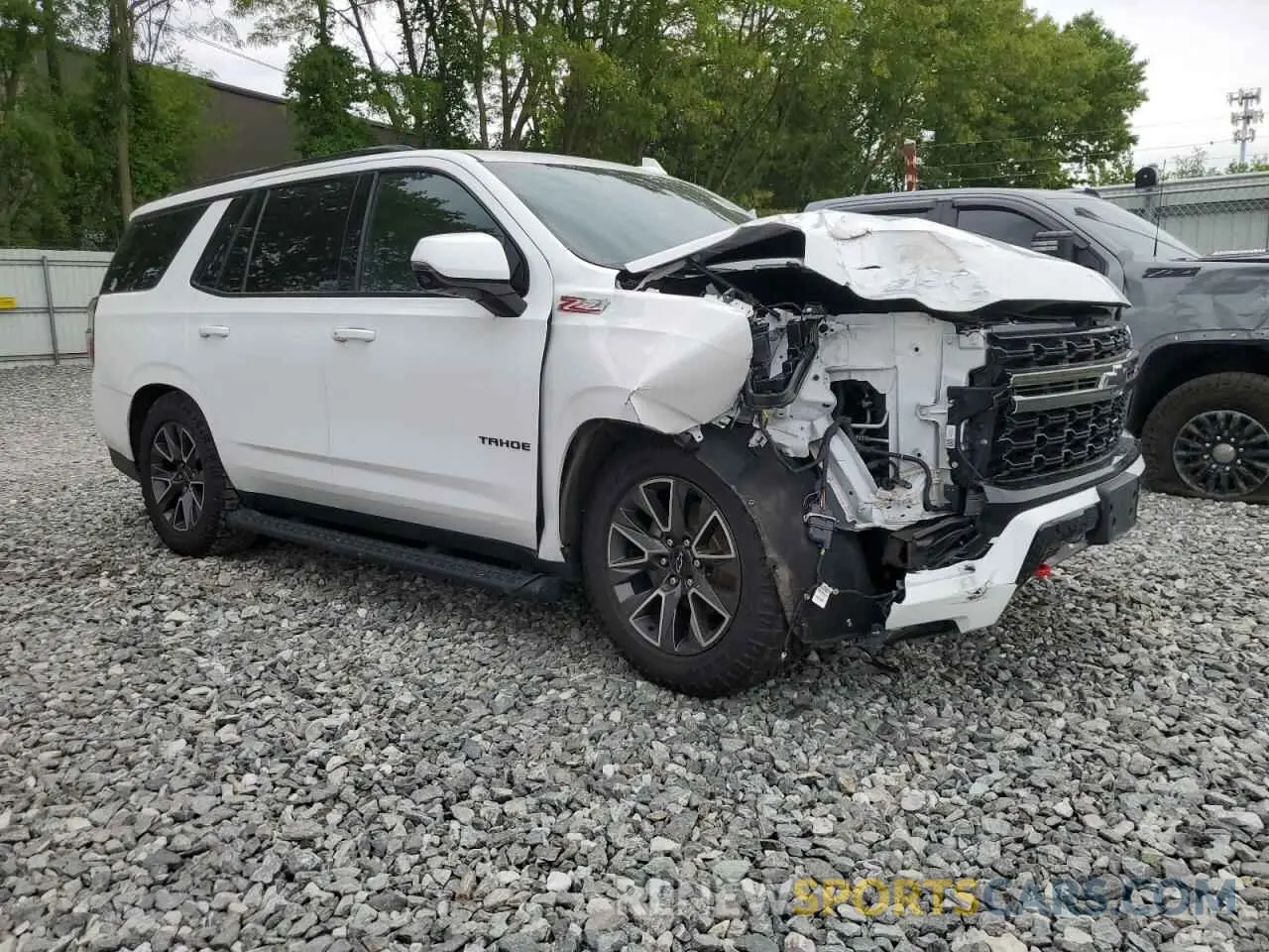 4 Photograph of a damaged car 1GNSKPKD5NR117658 CHEVROLET TAHOE 2022