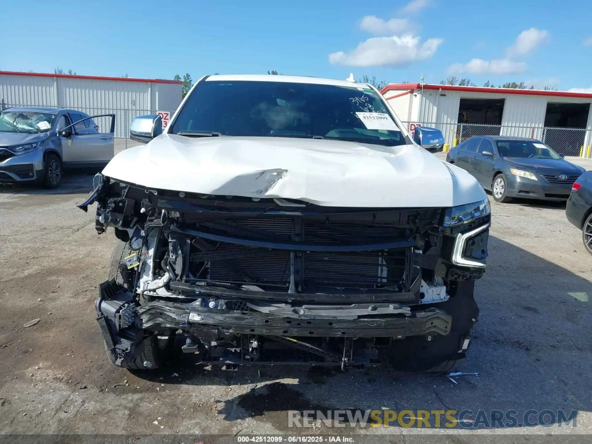13 Photograph of a damaged car 1GNSKSKD0PR453465 CHEVROLET TAHOE 2023
