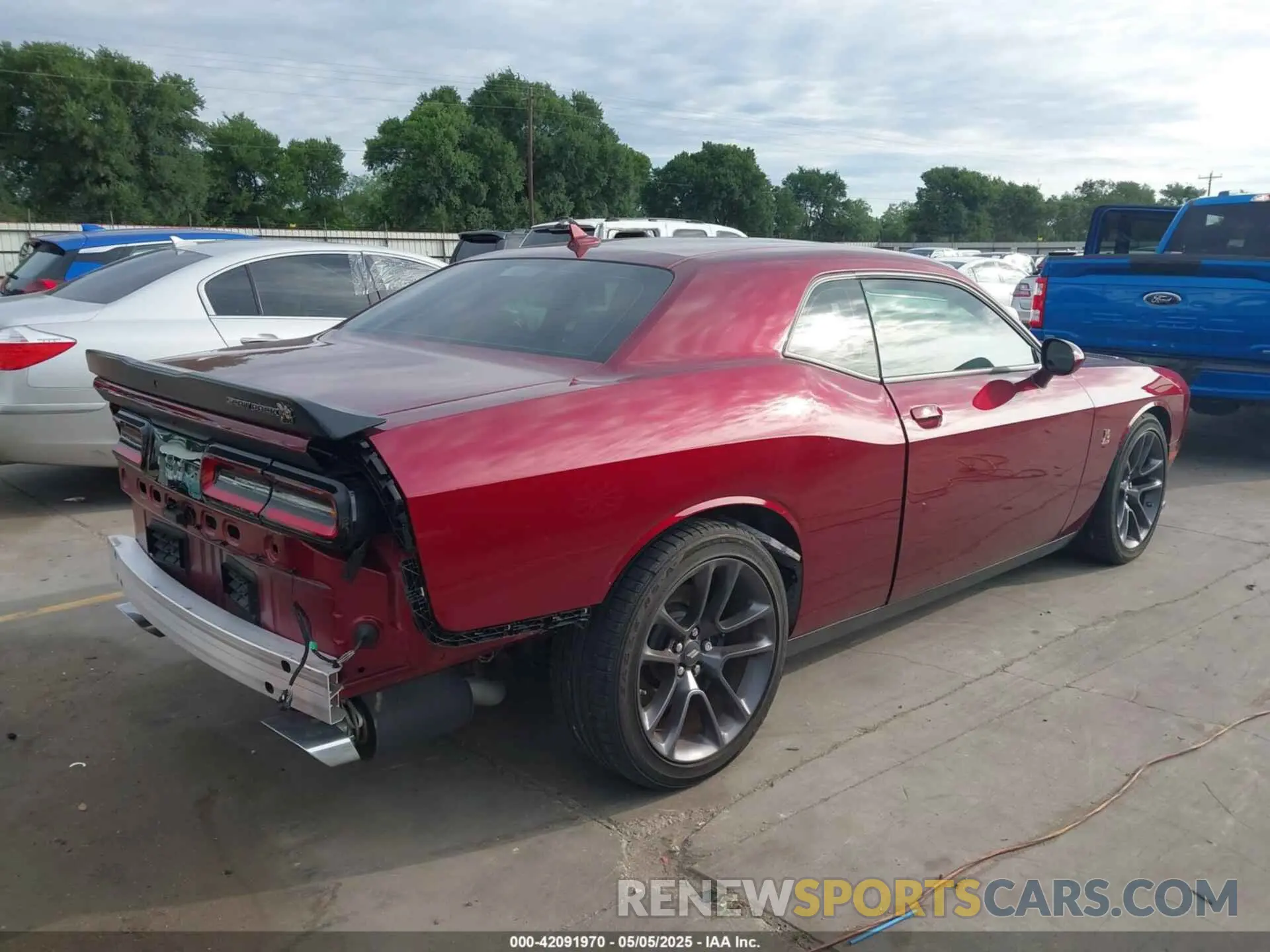 4 Photograph of a damaged car 2C3CDZFJ4PH617904 DODGE CHALLENGER 2023