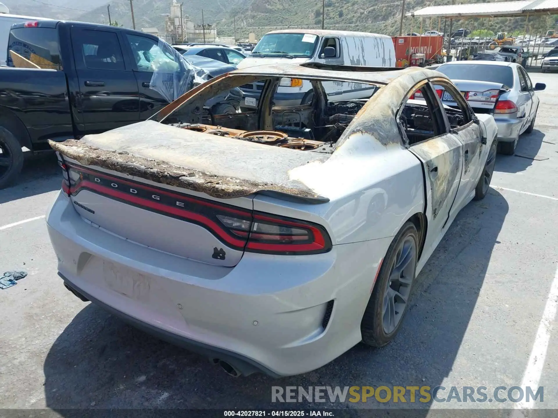 4 Photograph of a damaged car 2C3CDXGJXPH613472 DODGE CHARGER 2023