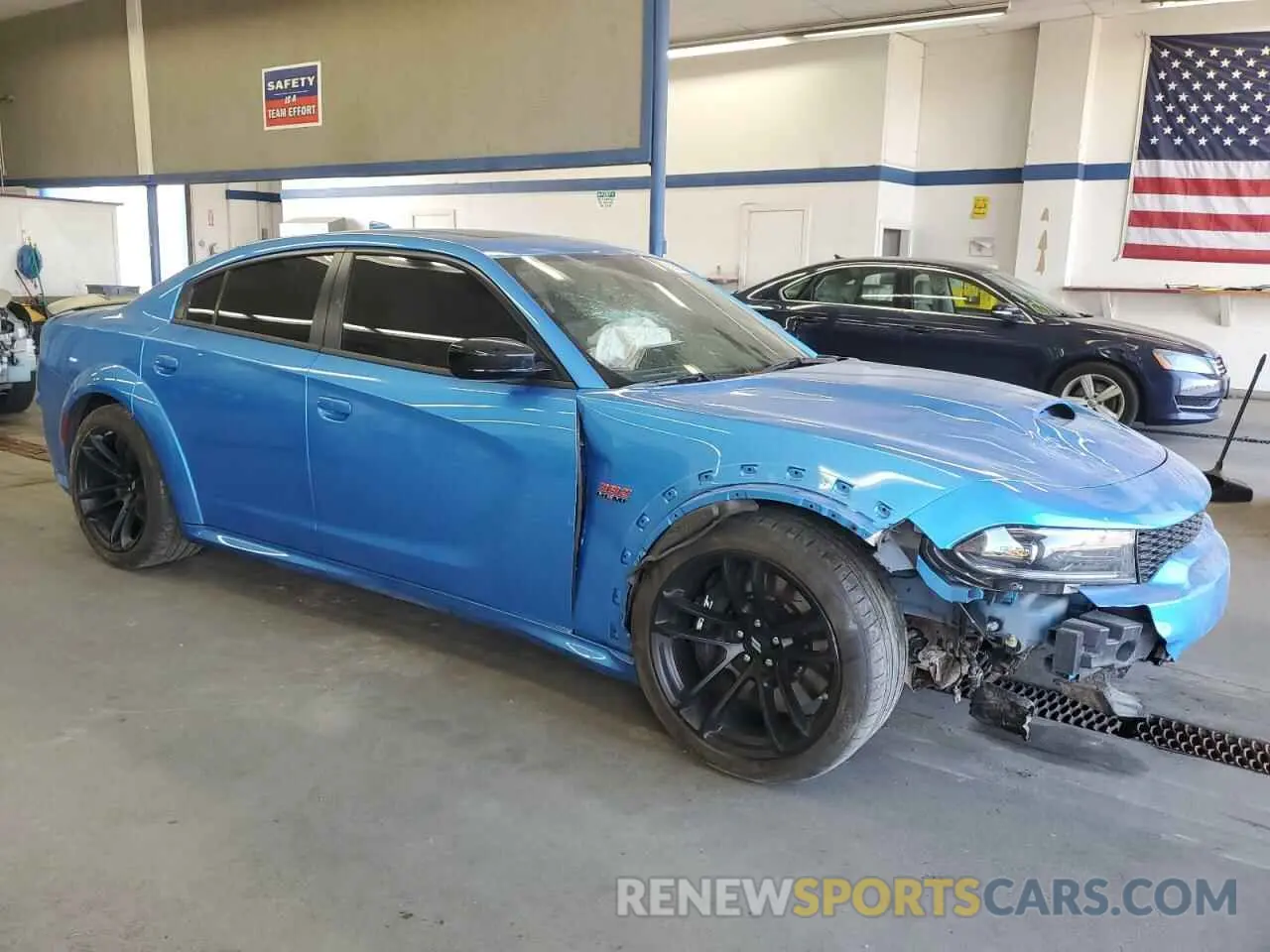 4 Photograph of a damaged car 2C3CDXGJXPH653745 DODGE CHARGER 2023