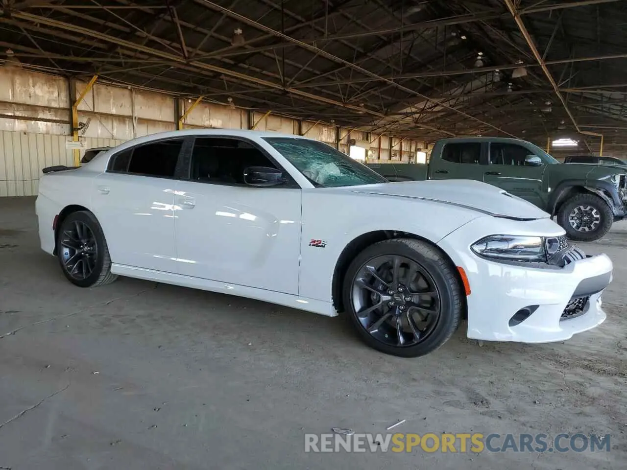 4 Photograph of a damaged car 2C3CDXGJXPH703057 DODGE CHARGER 2023