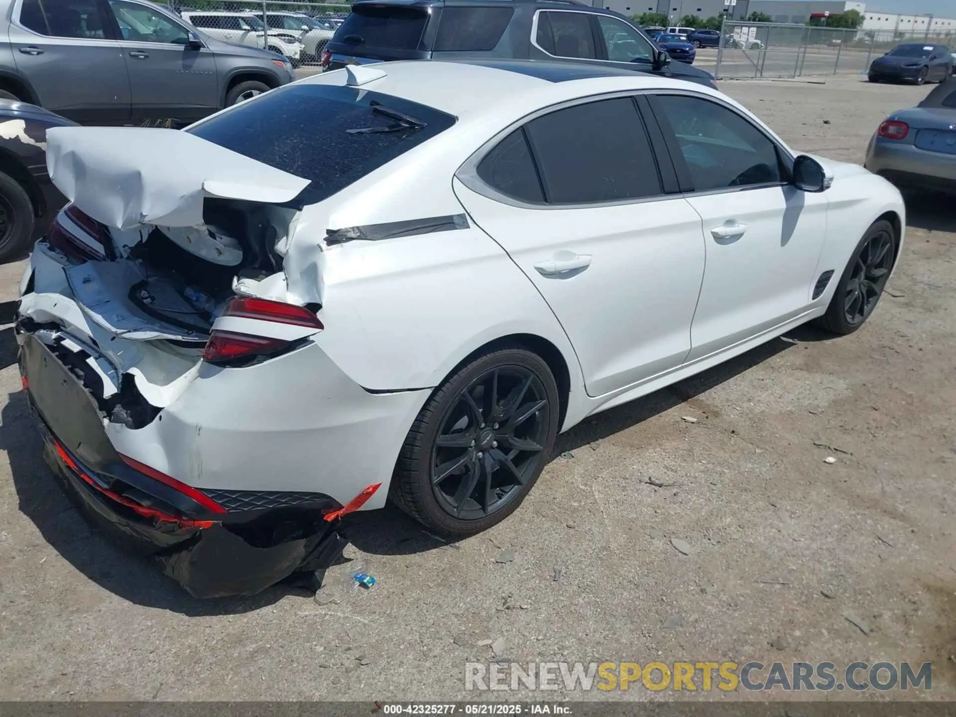 4 Photograph of a damaged car KMTG34TA5NU103935 GENESIS G70 2022