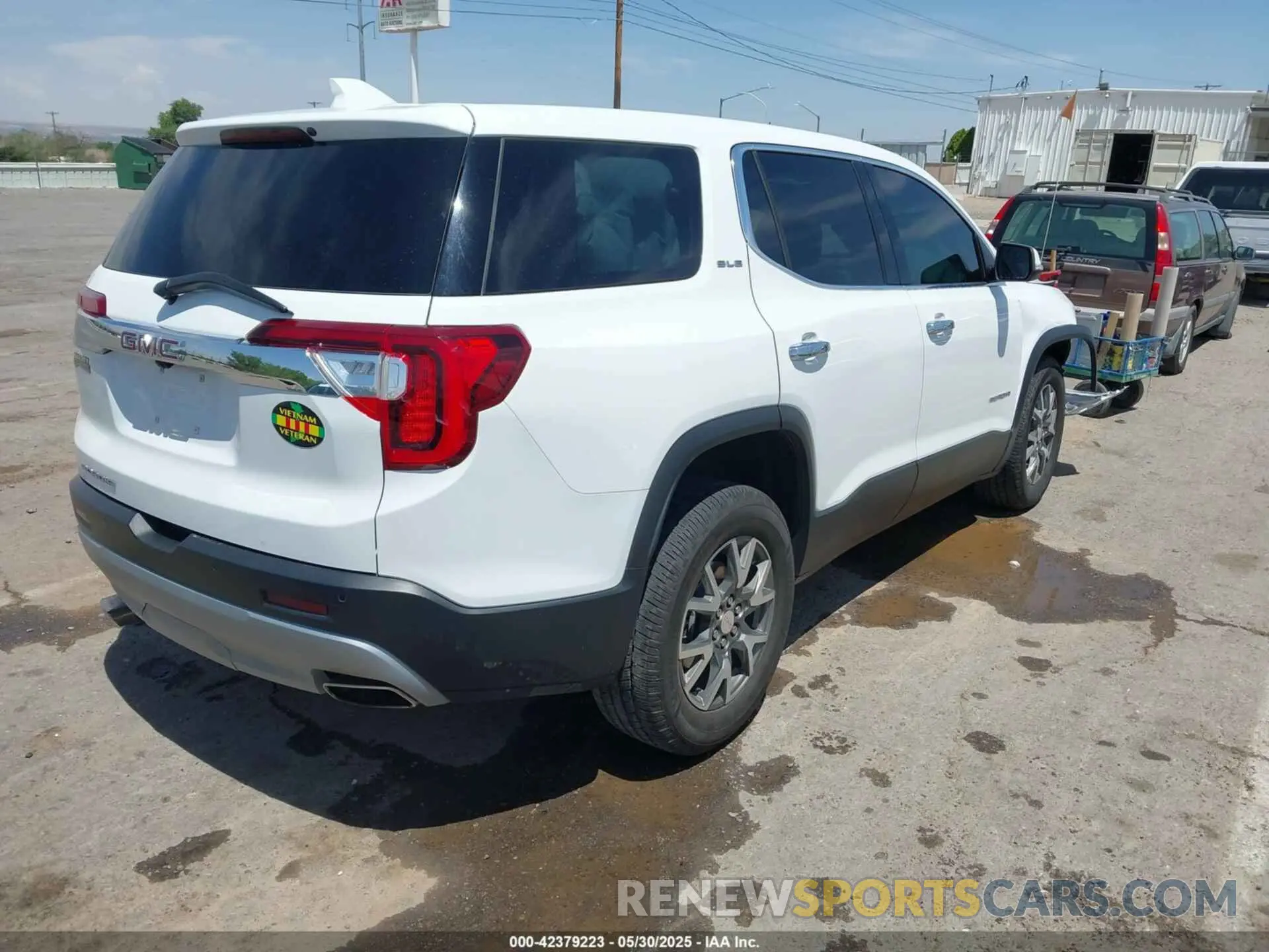 4 Photograph of a damaged car 1GKKNKL42PZ103838 GMC ACADIA 2023