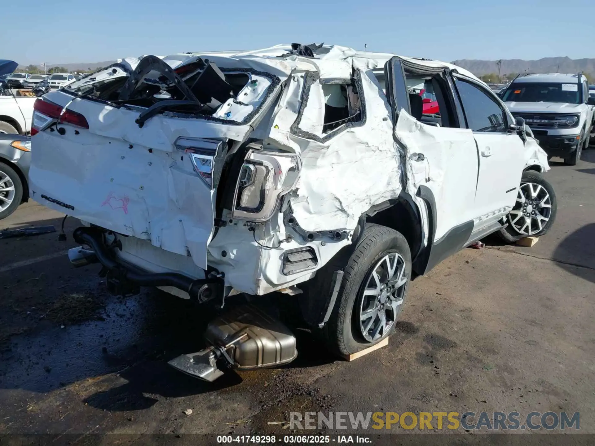 4 Photograph of a damaged car 1GKKNKL4XPZ114733 GMC ACADIA 2023