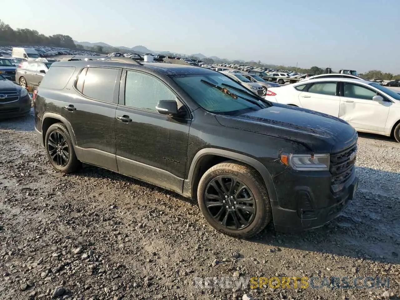 4 Photograph of a damaged car 1GKKNUL48PZ173744 GMC ACADIA 2023