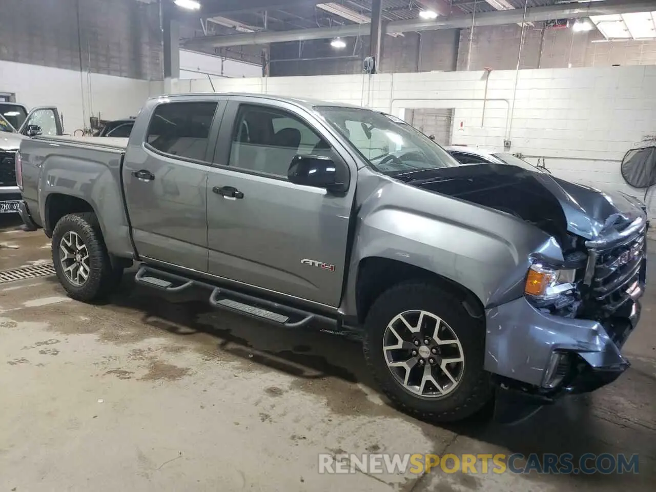 4 Photograph of a damaged car 1GTG6FEN1M1203936 GMC CANYON 2021