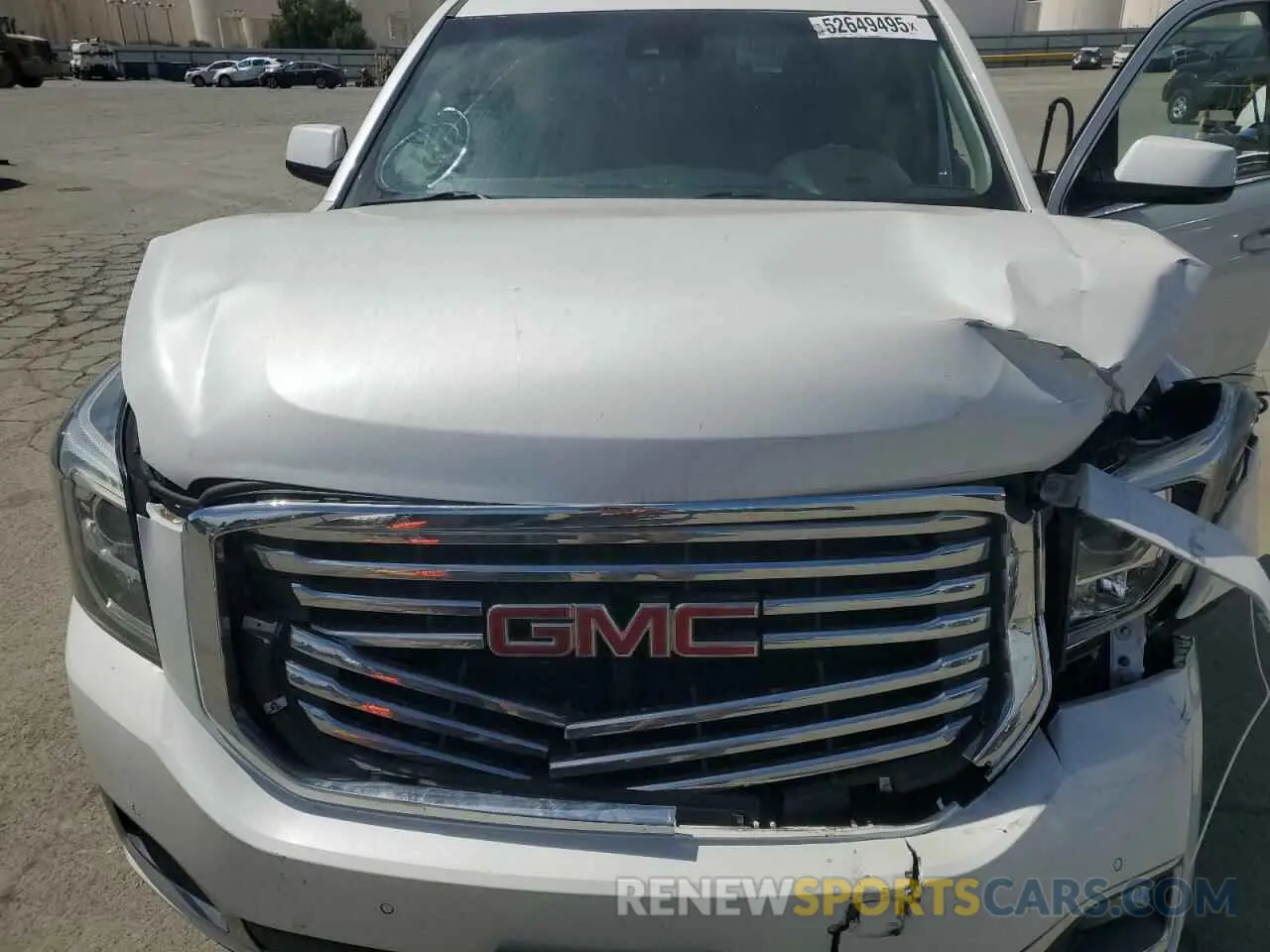 11 Photograph of a damaged car 1GKS2GKC5KR383231 GMC YUKON 2019