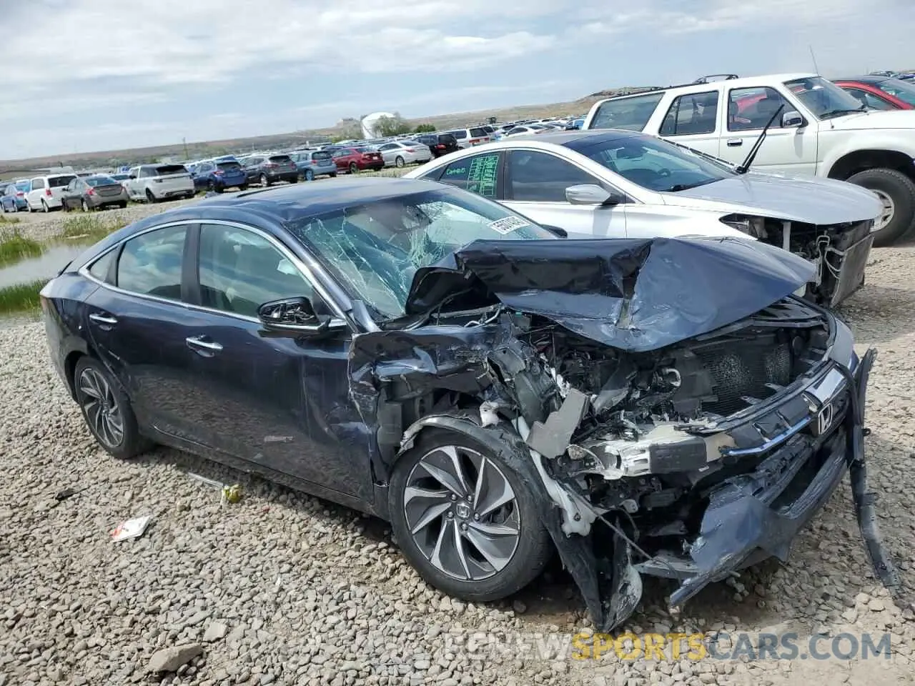4 Photograph of a damaged car 19XZE4F93KE023398 HONDA INSIGHT 2019