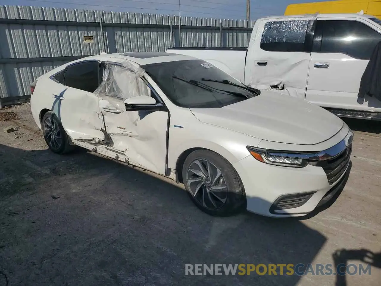 4 Photograph of a damaged car 19XZE4F96KE001993 HONDA INSIGHT 2019
