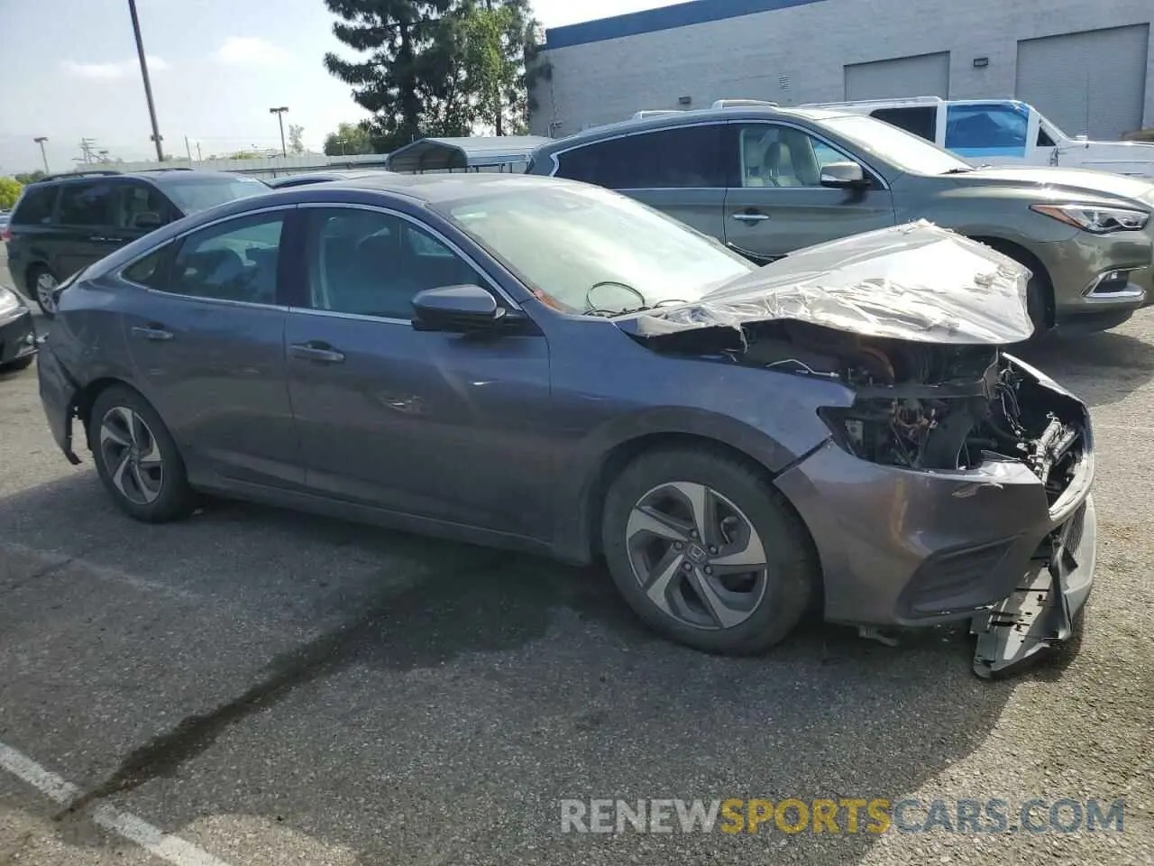 4 Photograph of a damaged car 19XZE4F54LE007306 HONDA INSIGHT 2020