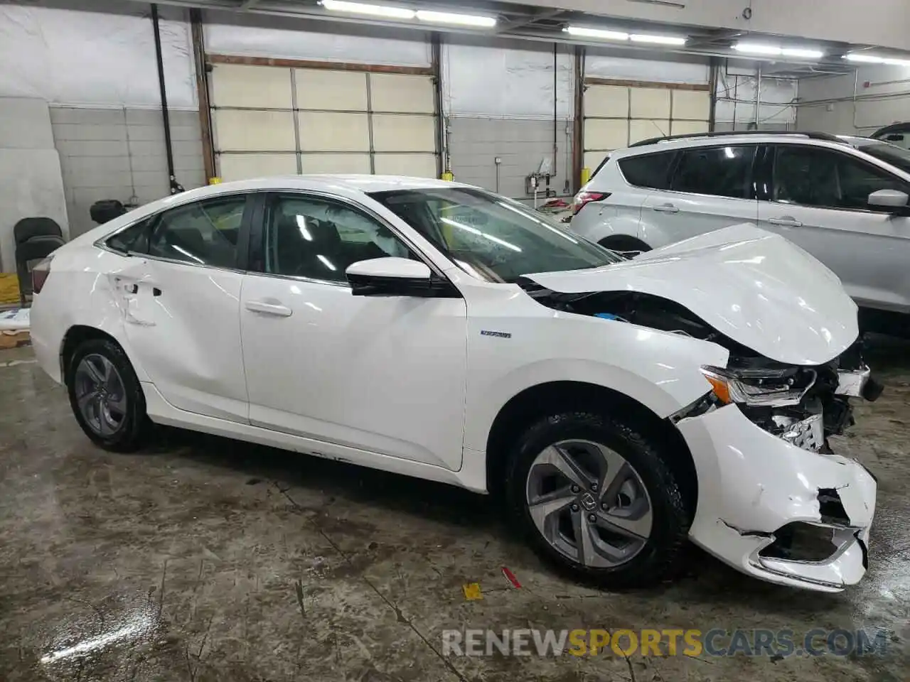 4 Photograph of a damaged car 19XZE4F58LE001699 HONDA INSIGHT 2020