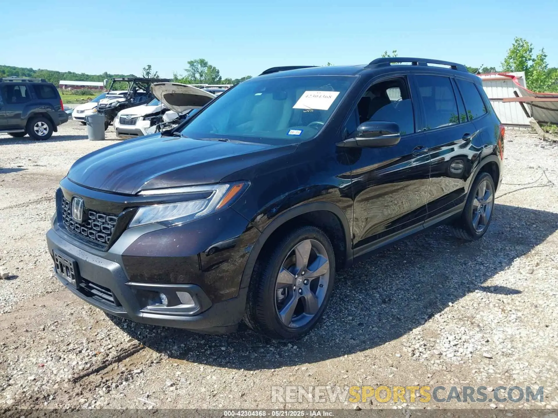 2 Photograph of a damaged car 5FNYF7H98MB007542 HONDA PASSPORT 2021