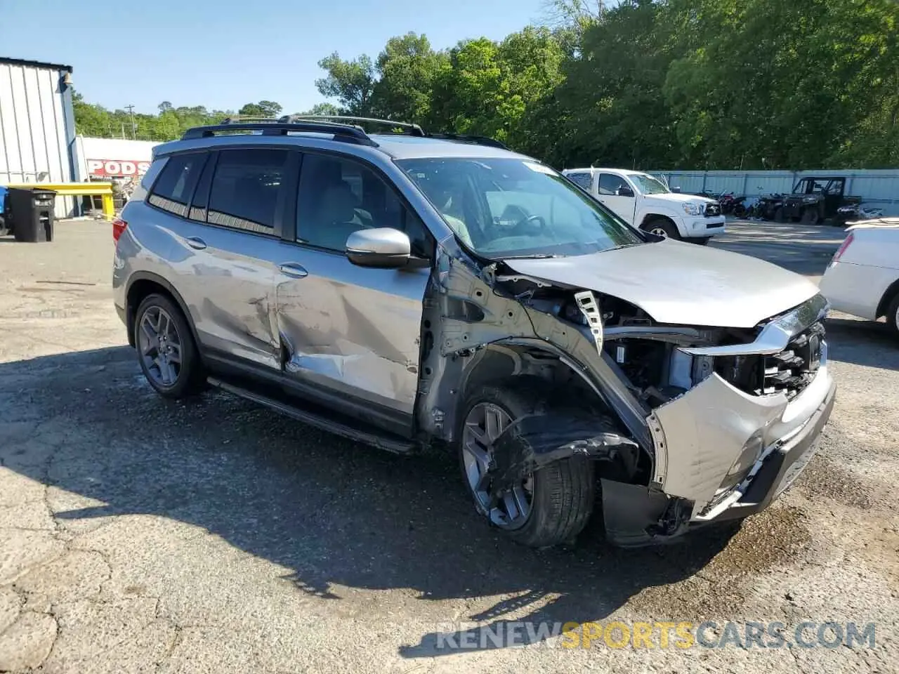 4 Photograph of a damaged car 5FNYF7H59NB003482 HONDA PASSPORT 2022