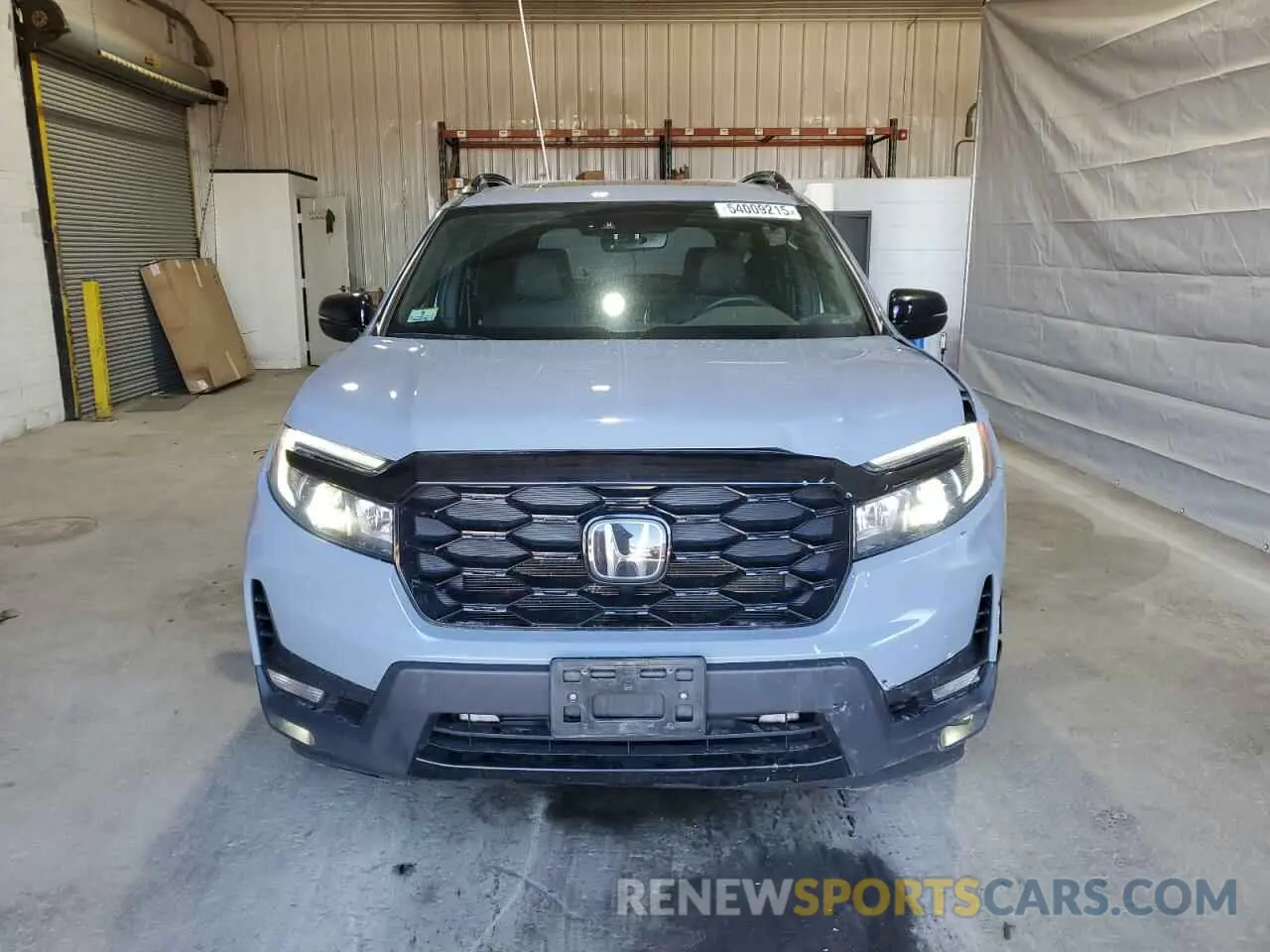 5 Photograph of a damaged car 5FNYF8H03PB034613 HONDA PASSPORT 2023
