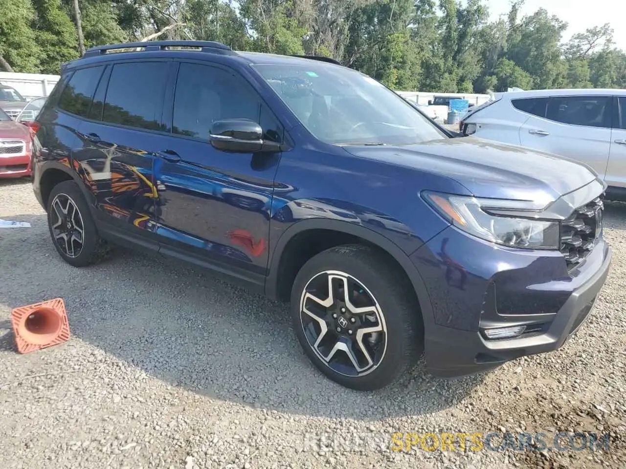 4 Photograph of a damaged car 5FNYF8H04PB014922 HONDA PASSPORT 2023