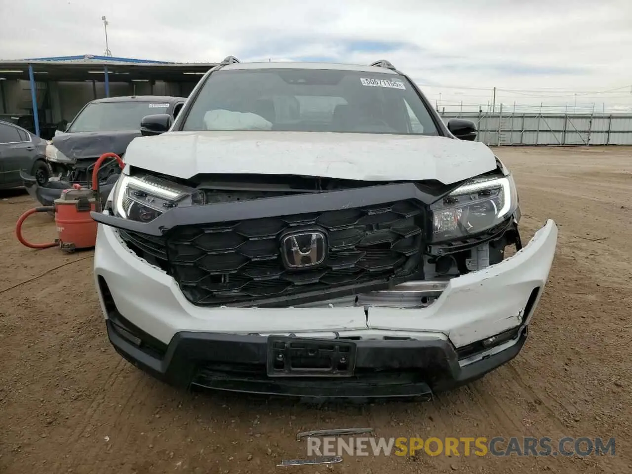 5 Photograph of a damaged car 5FNYF8H05PB013536 HONDA PASSPORT 2023