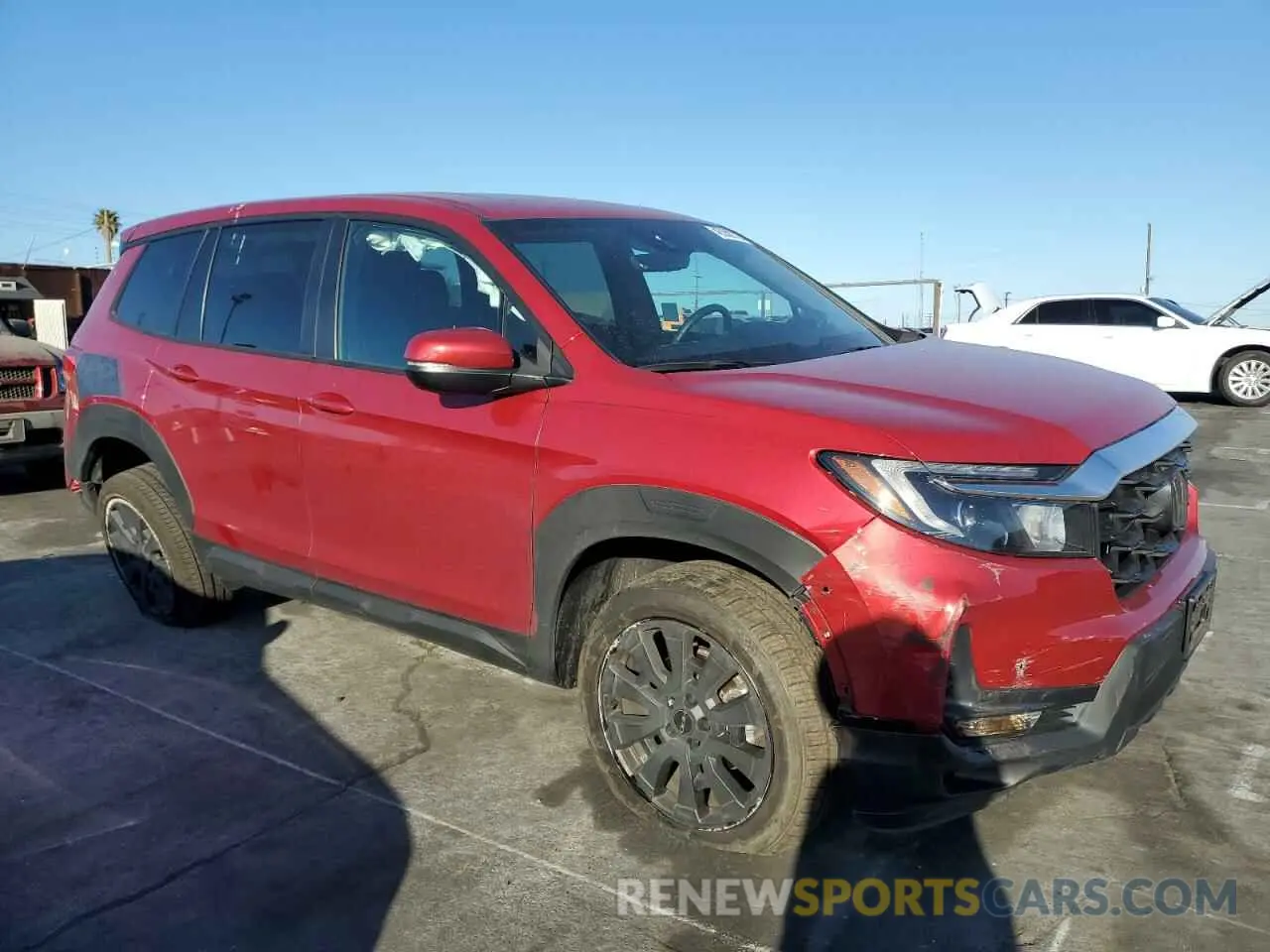 4 Photograph of a damaged car 5FNYF8H54PB036057 HONDA PASSPORT 2023